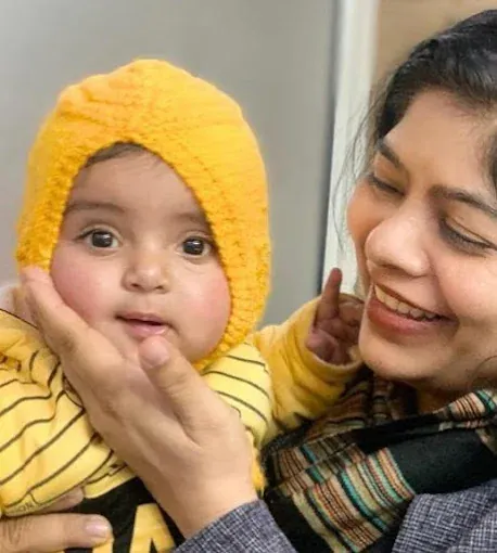 Dr. Bhavya Rathore with an infant