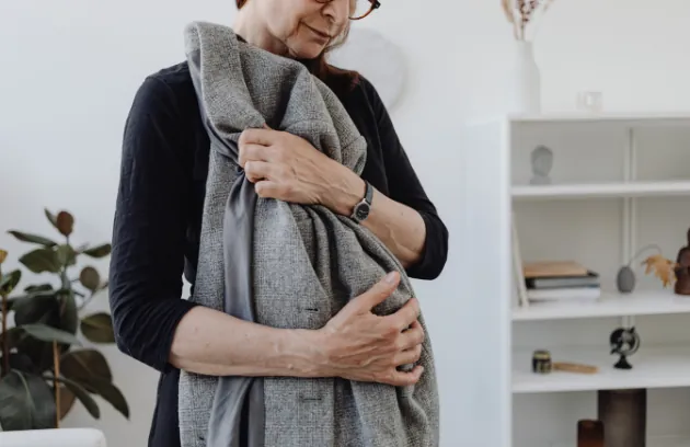 Woman in midlife at home, representing menopause care